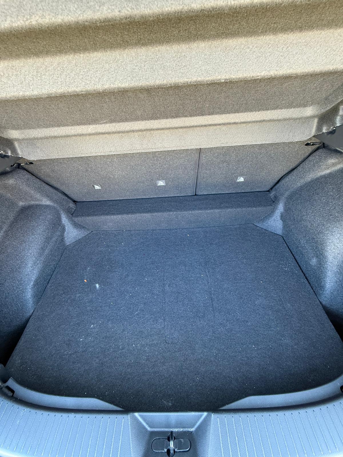 Pet hair removal and boot detail before — heavily soiled car boot